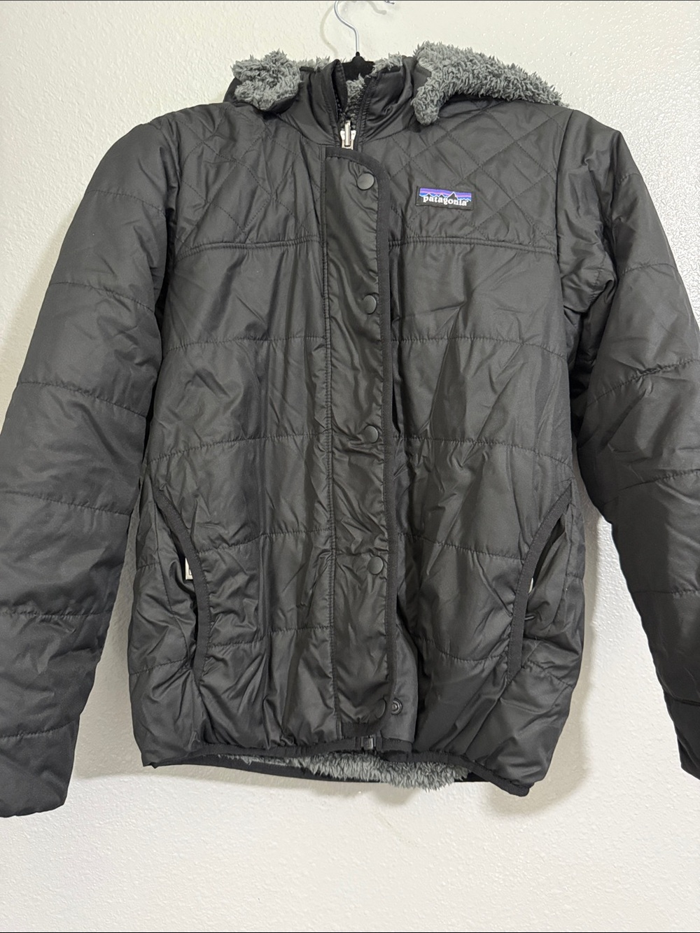 Patagonia kids size 10  black /slate grey for fleece 
Reversible Jacket